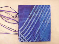 Blue and purple paint wash on this hand-made book